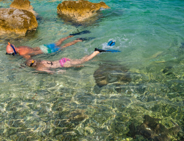 Young couple snorkeling on Island Krk, Croatia, Adriatic sea, Europe.